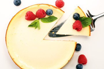 Homemade cheesecake with fresh raspberries and mint for dessert - healthy organic summer dessert pie cheesecake. Vanilla Cheese Cake