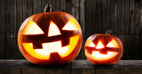 Halloween pumpkins on dark wooden background
