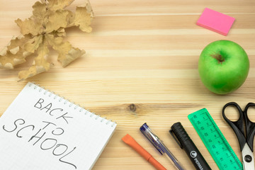 back to school. the first of September. thematic background of the school. Copy space. View from above. school accessories on a wooden background.