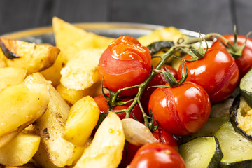 baked potatoes with tomatoes and zucchini