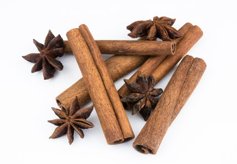 cinnamon sticks and anise spice star, isolated on white background close-up. fragrant spices.