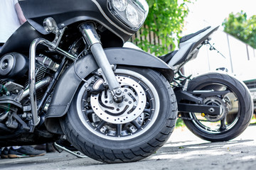 Obraz premium Vintage motorcycle parking on the road. Side view, close up