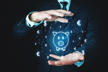 Man holding piggy bank with currency symbols. Investment concept