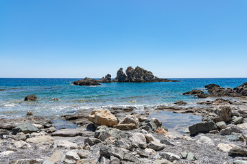Lybian Sea compressed rock layers island cut off mainland of south central Mediterranean coast of Crete, Greece. Nature and Geological science concept