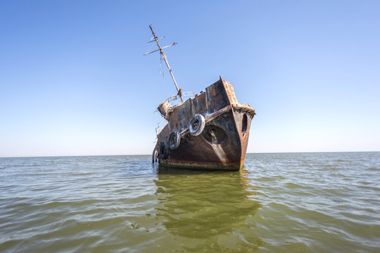 Abandoned Tuzla tug boat shipwreck in Sacalin peninsula in Danube Delta, Romania