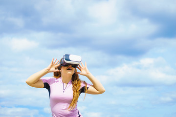 Woman wearing VR outside