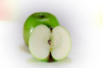 green Apple in a cut on a perfect white background