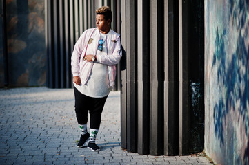 Stylish hipster arab man guy posed outdoor in street. Style rap singer.