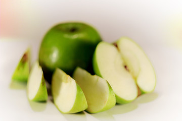 green Apple in a cut on a perfect white background