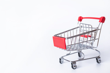 Red Shopping cart or supermarket cart on white background with copy space