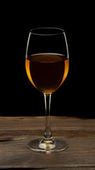 Glass still life image A glass of red wine in a glass on a black background