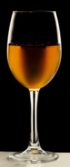 Glass still life image A glass of red wine in a glass on a black background