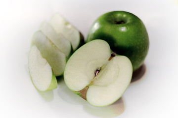 green Apple in a cut on a perfect white background