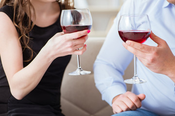 Young pair drinking wine in romantic concept