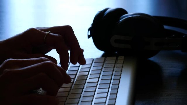Woman's hands typing on the keyboard