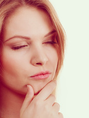 Fototapeta premium Portrait of curious woman thinking
