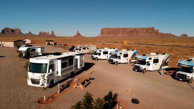 RV park (campground) near the Oljato–Monument Valley, Utah. Aerial view, from above, drone shooting. Arizona - Utah border. Sunset