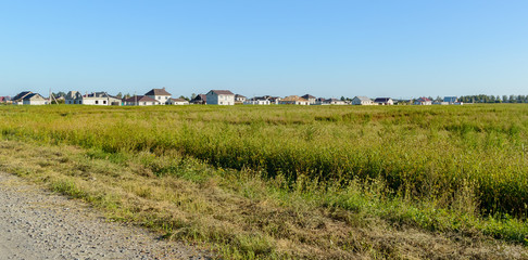 Summer warm evening near the new village. Good weather