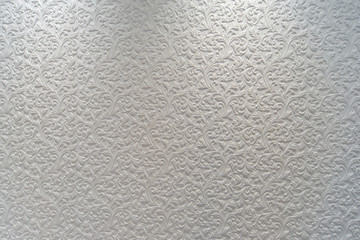 White plaster background floral pattern