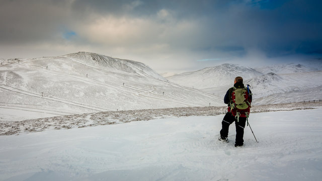 A hillwaker in the snow above Glenshee Scotland