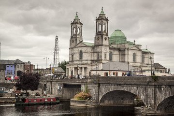 Fototapeta na wymiar River and Galway Cathedral of 'Our Lady Assumed into Heaven and St Nicholas' in Galway. Ireland