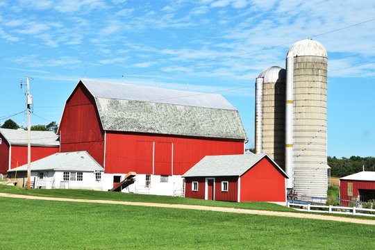 Red Barns with Silos