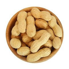 Bowl of dry roasted peanuts isolated on white