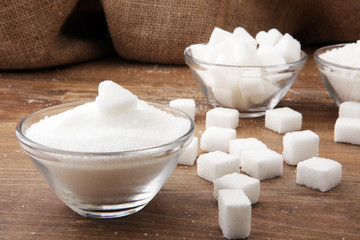 Various types of sugar, white sugar on wooden table.