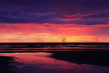 Fototapeta na wymiar Wind Turbine Beach Sunset