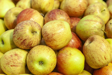 Fresh juicy apples on the store counter. View from above.