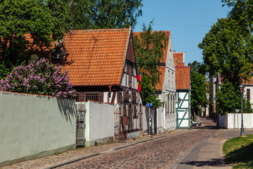 Narrow street of the Old Town district of Klaipeda city, Lithuania.