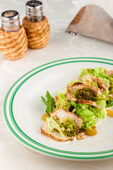 Mix salad with chicken and pine nuts