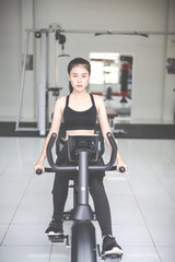 Fototapeta premium Fitness woman health exercise at gym. Healthy workout concepts.