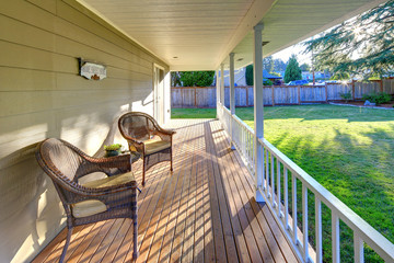 Wrap around porch with view of the back yard.