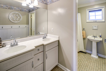 Rustic bathroom with dual vanity cabinet