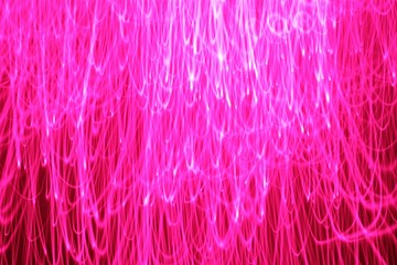 Fototapeta premium Bright neon pink lighting fountain glare flare design background
