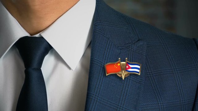 Businessman Walking Towards Camera With Friend Country Flags Pin China - Cuba