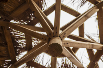 beach, sea, ocean, sky, hut, tropical, travel, blue, water, summer, vacation, sand, house, island, nature, resort, landscape, coast, roof, umbrella, tourism, sun, paradise, relax, parasol