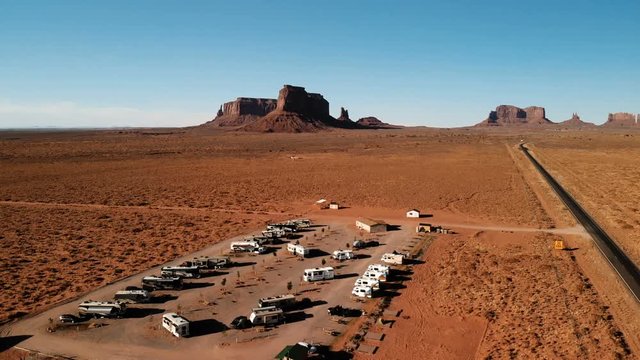 RV park (campground) near the Oljato–Monument Valley, Utah. Aerial view, from above, drone shooting. Arizona - Utah border. Sunset