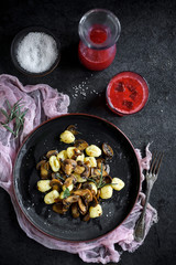 Prepared mushrooms and gnocchi dish served on the table,selective focus