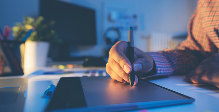 Graphic designer working on digital tablet