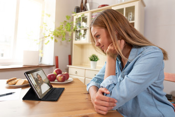 Woman talking with man through a video chat