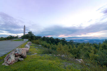 Fog lifts from the Kittany Mountains at sunset at High Point State Park, the top of NJ, in mid...
