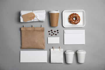 Flat lay composition with items for mock up design on gray background. Food delivery service