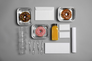 Flat lay composition with items for mock up design on gray background. Food delivery service
