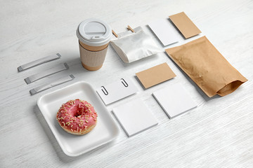 Composition with items for mock up design on wooden background. Food delivery service