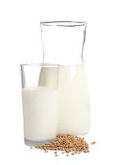 Glassware with hemp milk on white background