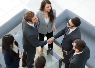 People, work and corporate concept - business team meeting at of