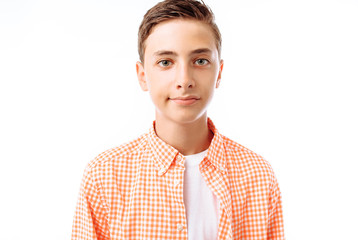 Closeup portrait of teenage boy, smiling face, in Studio on white background, isolated