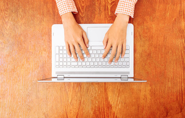 Closeup of fingers typing on laptop, keyboard, work or study on laptop, in Studio on white background